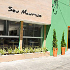 Seu Maurício outside